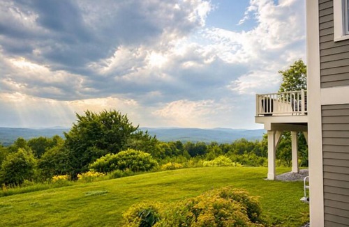 Elkins House | Sunset Slopes: A spacious 4-bedroom home in scenic Wilmot, NH, with garden views.