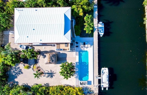 Big Pine Key House | Tropical Oasis with Beautiful Home, Pool, Dock and Tiki Hut