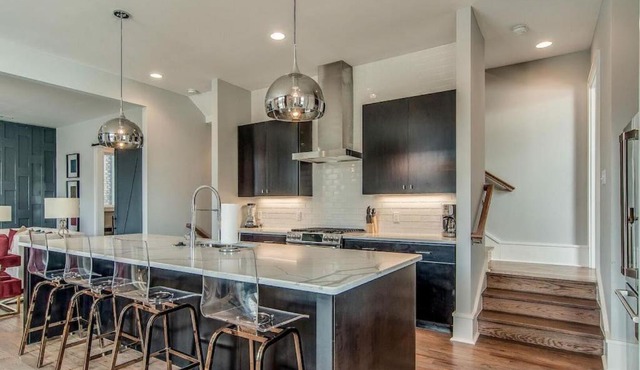 Amplify at the Gulch modern 3 story condo 2 car garage rooftop fire pit security and view in Nashville