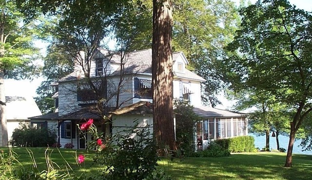 Gorgeous Sandy Beachfront Paw Paw lake home with 155 ft. of frontage and dock in Watervliet