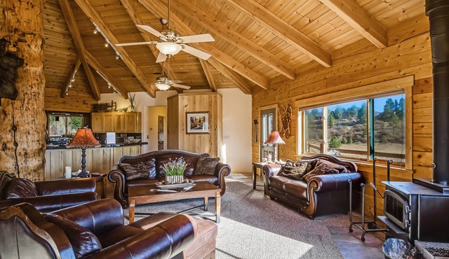 Large family-friendly cabin with game room, hot tub, & wraparound deck in Pagosa Springs